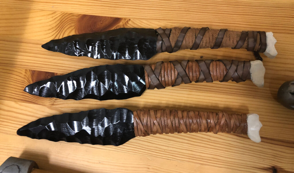 wood carved obsidian daggers